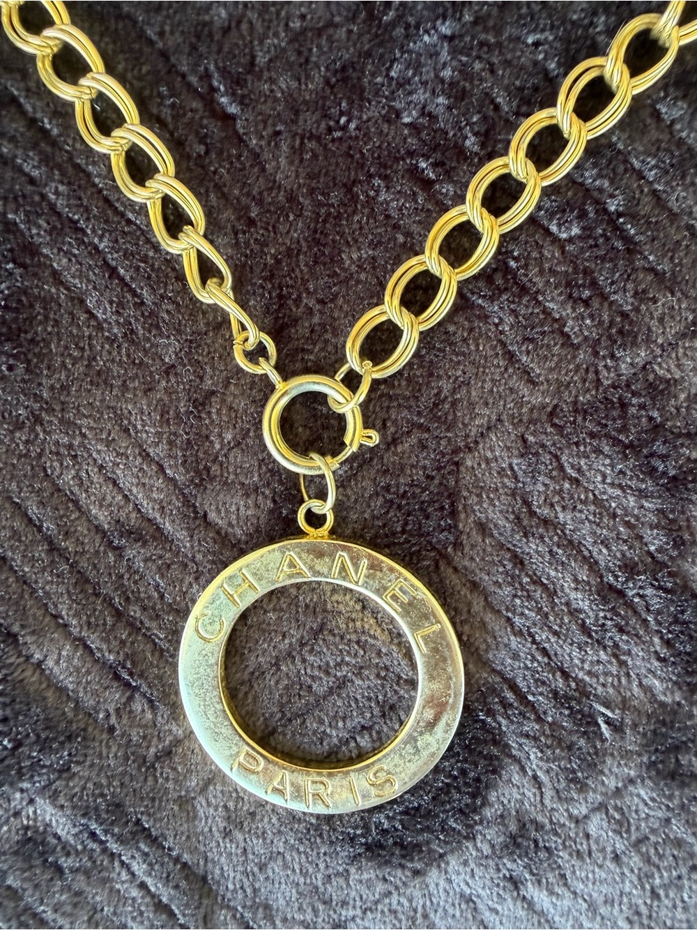 Vintage Channel part of key chain that was transformed into a pendent on a chain